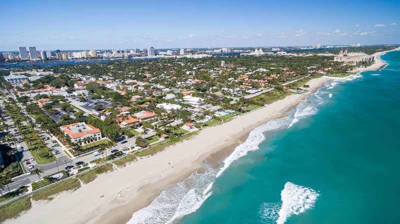 Palm Beach, Florida coastline and island vistas from above, iconic Gold Coast setting for luxury and ultra luxury condos; robust preconstruction and resale inventory. Featuring coastal, aerial, and view.