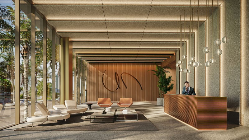 Cove Miami in Miami presents luxury and ultra luxury condos in preconstruction, featuring a grand lobby with a reception desk, sculptural wall art, lounge seating, and full-height glass along a palm-lined frontage.