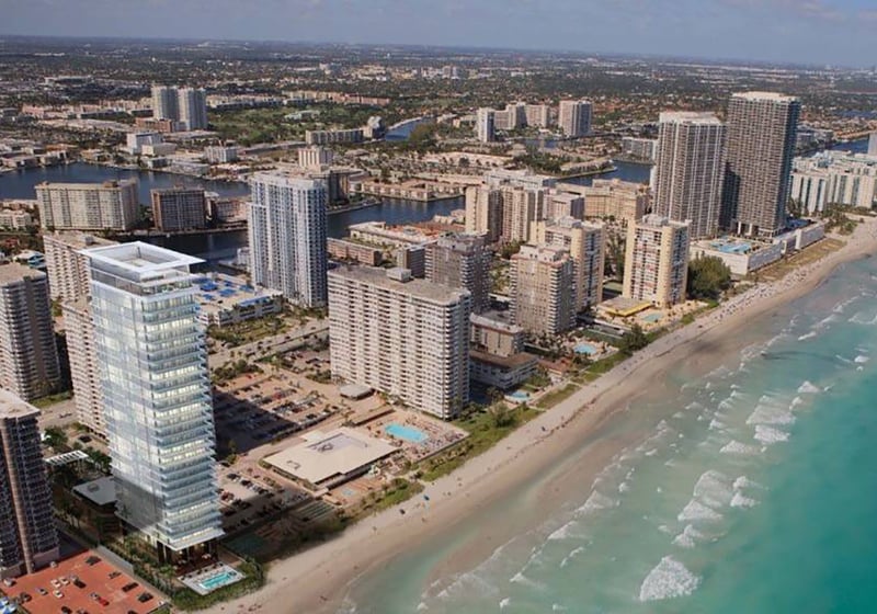 Aerial coastal view of 2000 Ocean in Hallandale Beach with oceanfront skyline, beach and Intracoastal waterways, showcasing luxury and ultra luxury resale condos in South Florida.