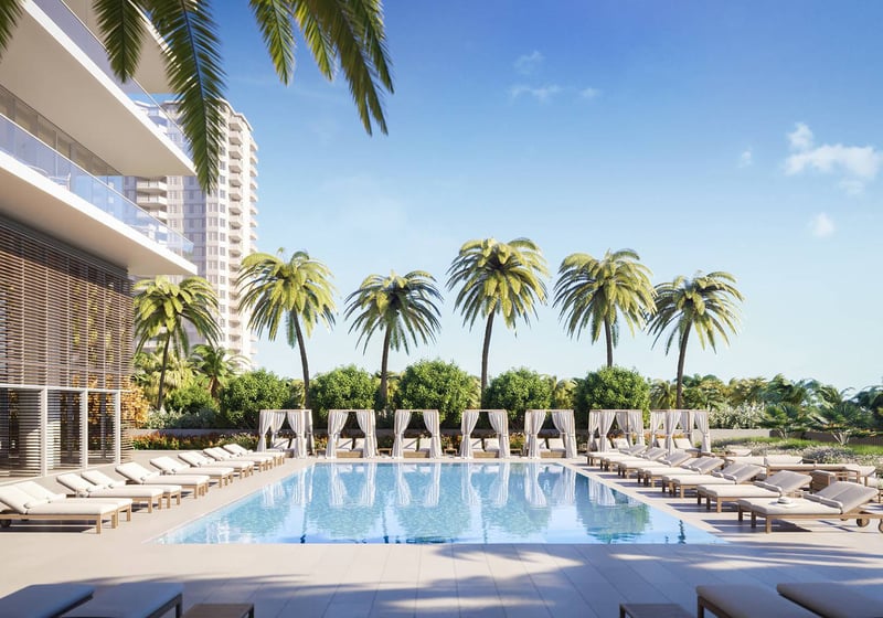 2000 Ocean Hallandale Beach resort-style pool with cabanas, loungers and palm landscaping, showcasing luxury and ultra luxury resale condos amenities on the South Florida oceanfront.