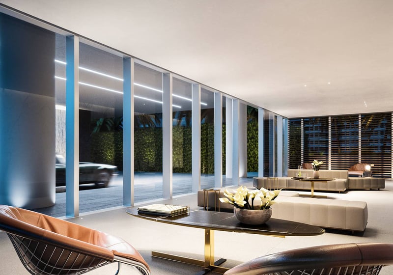 2000 Ocean residents' lobby with floor-to-ceiling glass, curated lounge seating and contemporary lighting in Hallandale Beach, South Florida, setting the tone for luxury and ultra luxury preconstruction condos and amenities.