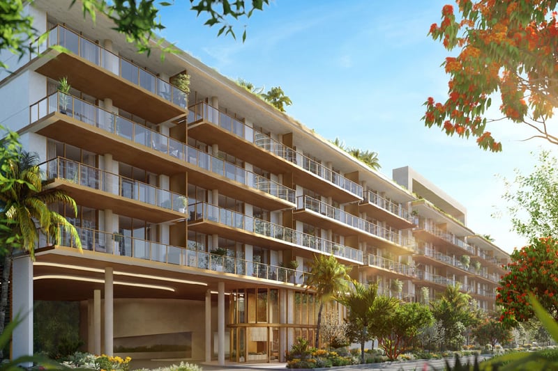 2200 Brickell exterior rendering with glass balconies, landscaped entry and tropical gardens, showcasing luxury and ultra luxury preconstruction condos in Brickell, Miami, Florida.