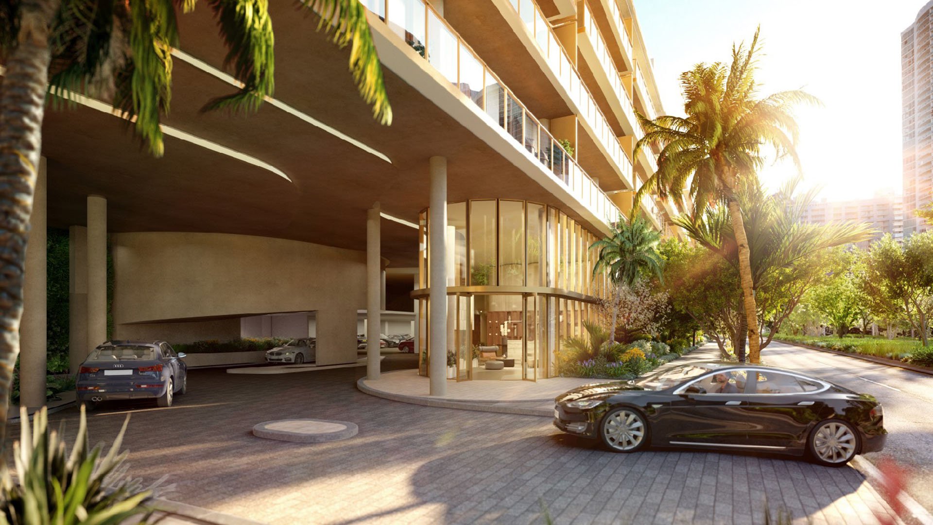 2200 Brickell arrival porte-cochere and glass lobby at sunset with palm-lined drive, showcasing luxury and ultra luxury preconstruction condos in Brickell, Miami, Florida.
