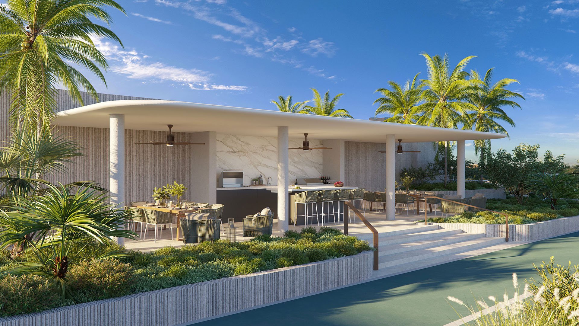 2200 Brickell outdoor dining pavilion with chef's summer kitchen, bar seating and tropical landscaping in Brickell, Miami, showcasing luxury and ultra luxury preconstruction condos amenities for indoor-outdoor entertaining.