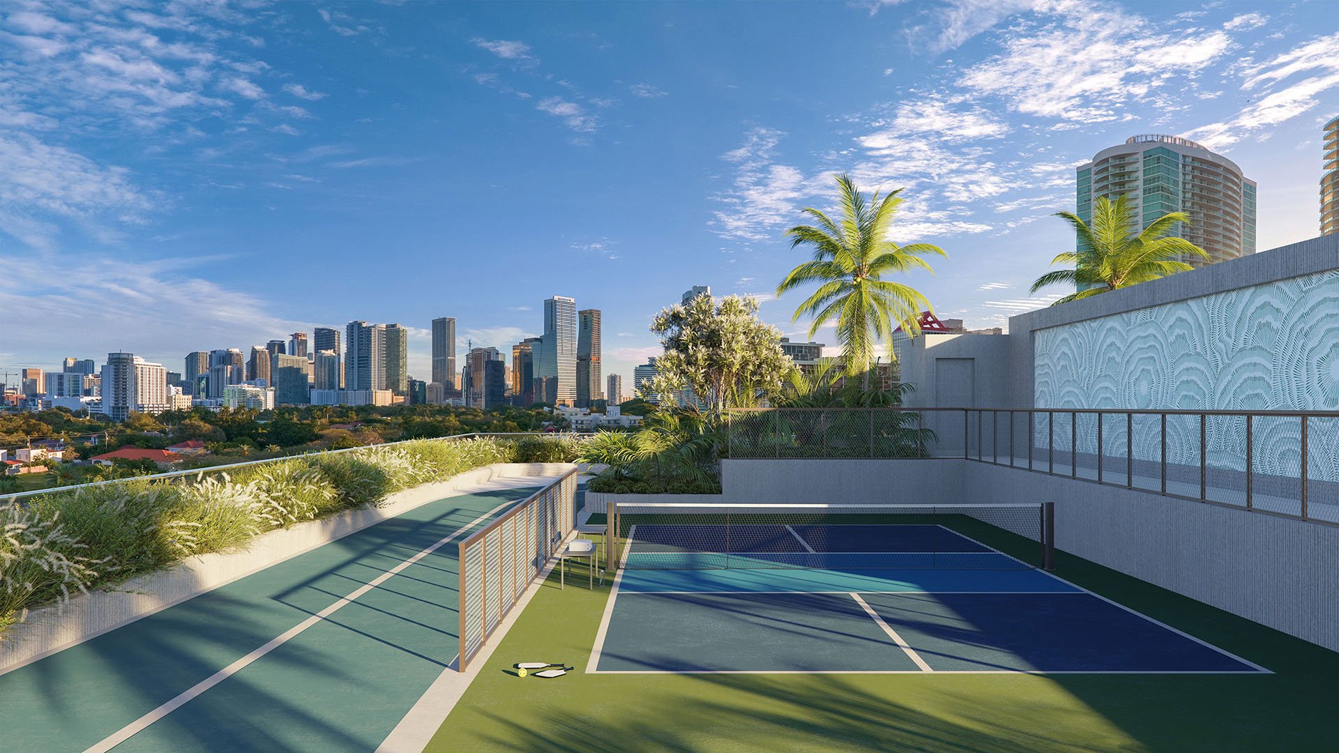 2200 Brickell rooftop tennis court with Miami skyline views, palm-lined landscaping and modern sport deck in Brickell, Miami, representing luxury and ultra luxury preconstruction condos with resort-style fitness amenities.