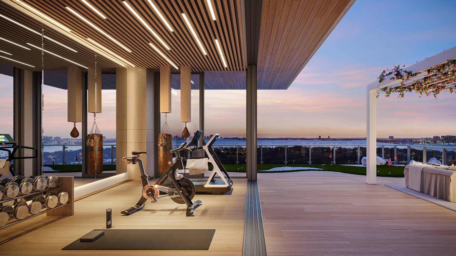 57 Ocean Miami Beach home gym with skyline and ocean view, showcasing luxury and ultra luxury preconstruction condos wellness amenities in Mid-Beach on Millionaire's Row, Miami Beach, Florida.