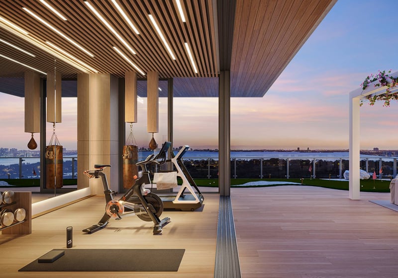 57 Ocean Miami Beach home gym with skyline and ocean view, showcasing luxury and ultra luxury preconstruction condos wellness amenities in Mid-Beach on Millionaire's Row, Miami Beach, Florida.