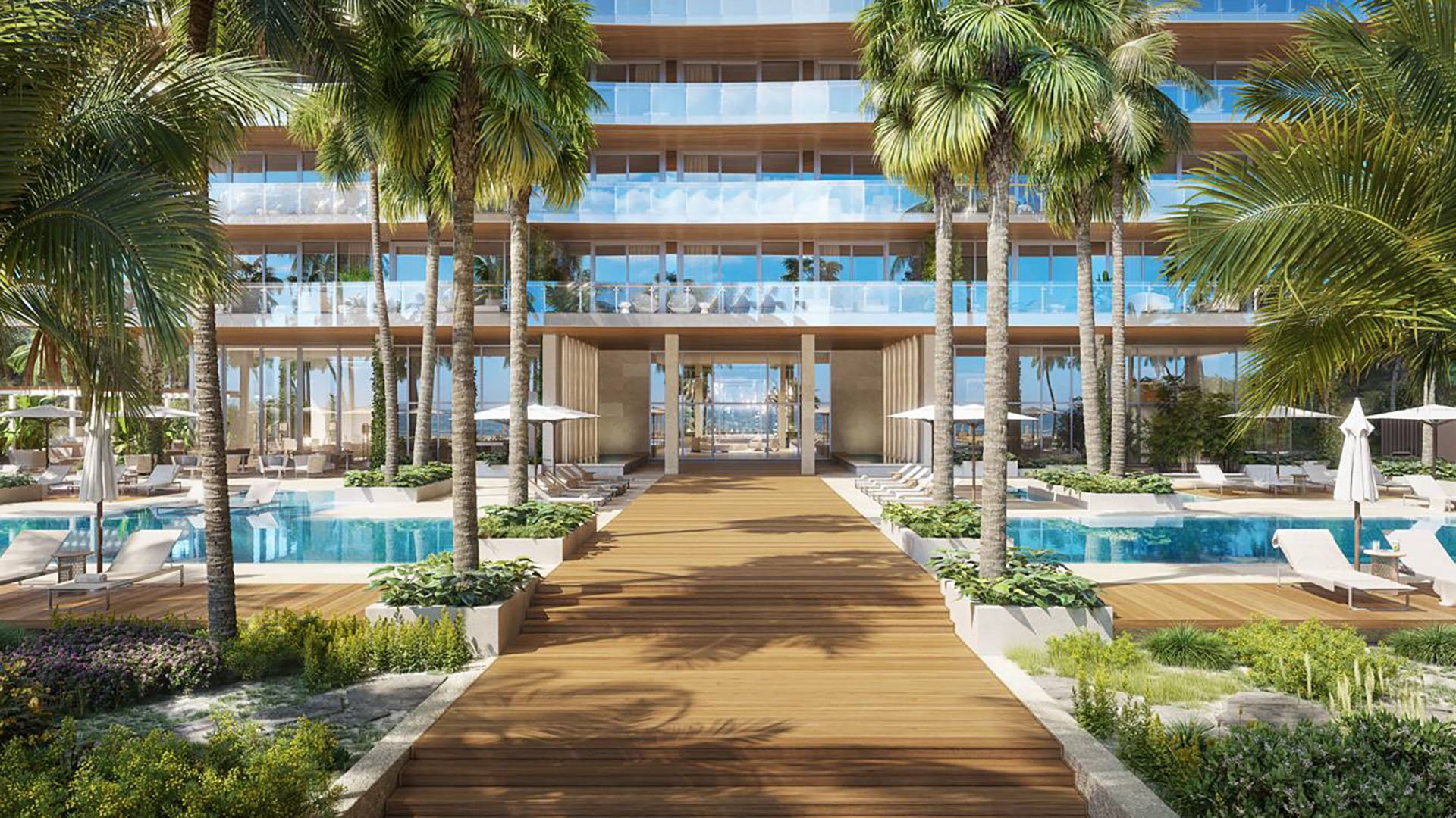57 Ocean Miami Beach poolside view toward resort front and entrance, showcasing luxury and ultra luxury preconstruction condos on Millionaire's Row, Mid-Beach, Miami Beach, Florida.