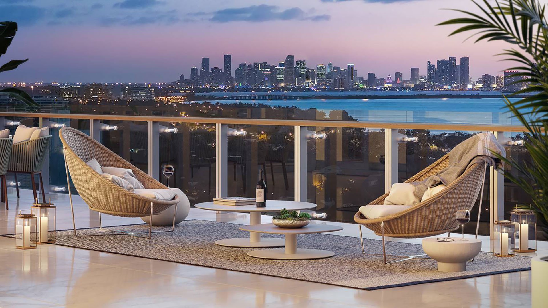 57 Ocean Miami Beach modern balcony with city skyline at sunset, showcasing luxury and ultra luxury preconstruction condos on Millionaire's Row, Mid-Beach, Miami Beach, Florida.