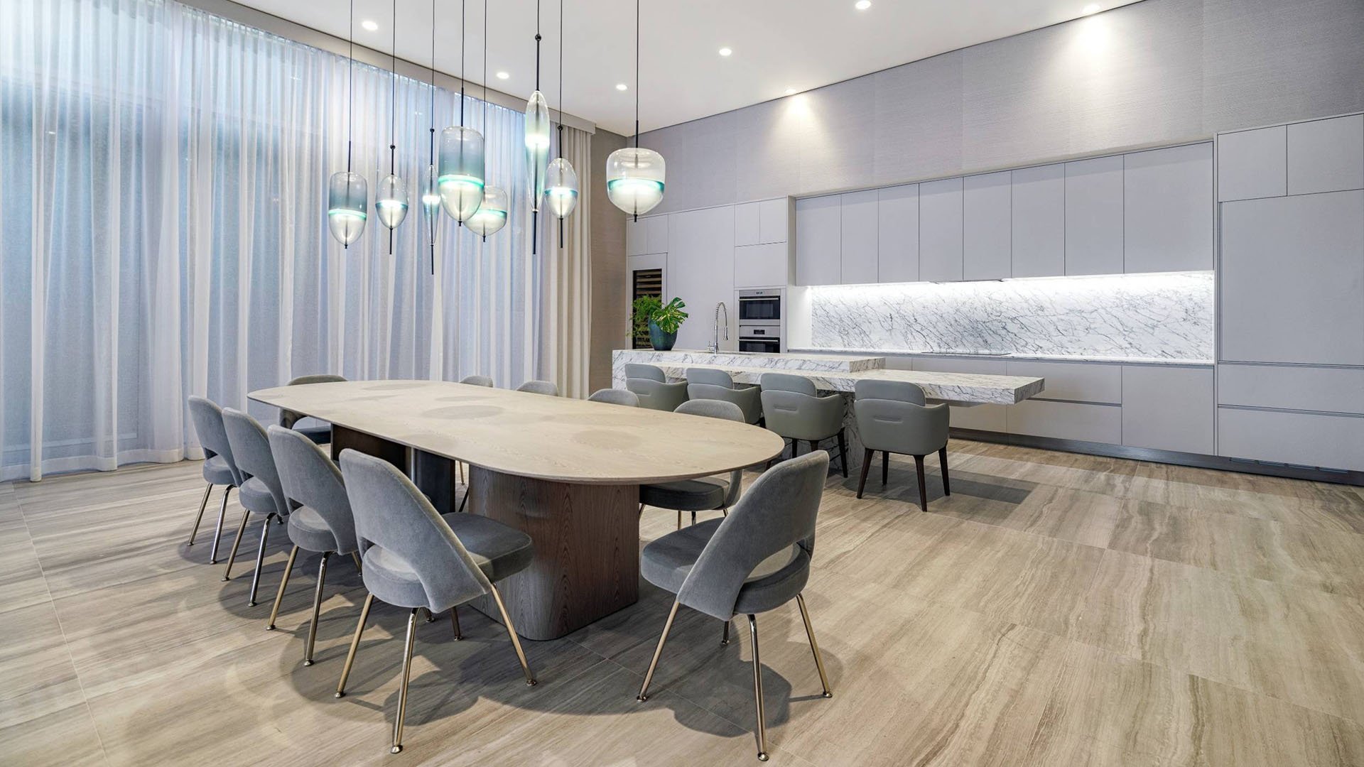 57 Ocean Miami Beach modern dining room interior design with statement lighting, showcasing luxury and ultra luxury preconstruction condos on Millionaire's Row, Mid-Beach, Miami Beach, Florida.