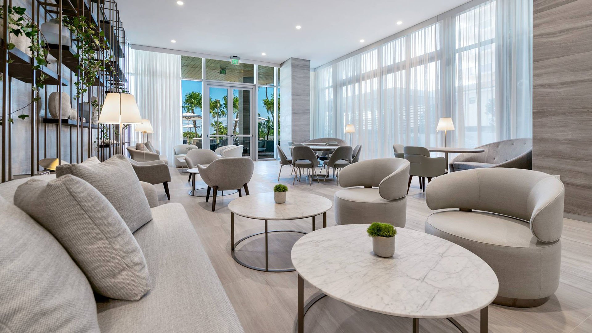 57 Ocean Miami Beach modern lounge interior with architectural details, showcasing luxury and ultra luxury preconstruction condos amenities in Mid-Beach, Miami Beach, Florida.