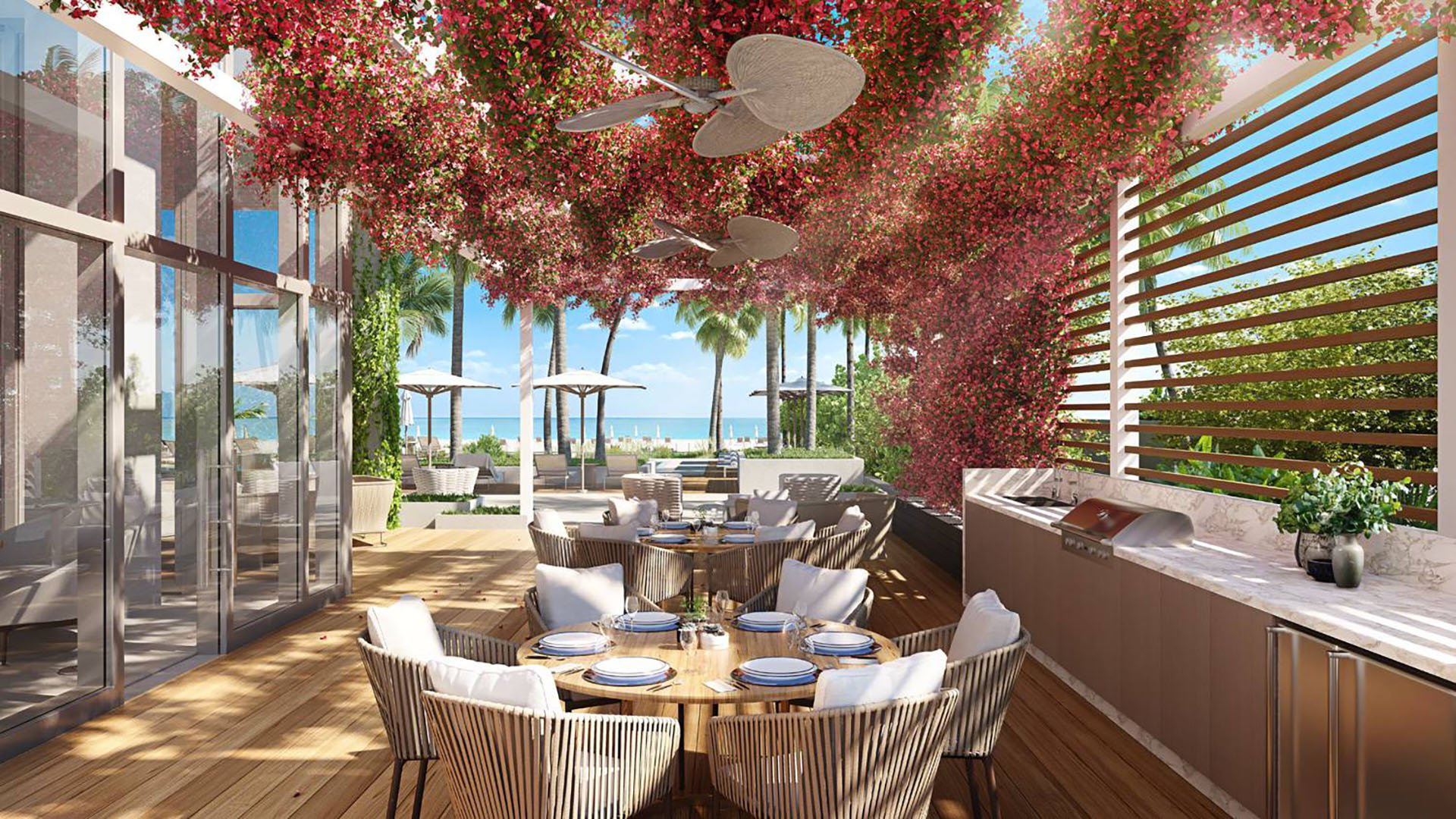 57 Ocean Miami Beach outdoor dining area with waterfront view, showcasing luxury and ultra luxury preconstruction condos lifestyle on Millionaire's Row, Mid-Beach, Miami Beach, Florida.