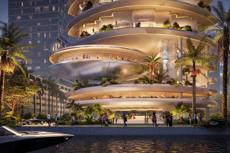 619 Residences by Foster + Partners + Nobu Hospitality in 619 Brickell, Miami, Florida, showcasing luxury and ultra luxury preconstruction condos with a dramatic waterfront entrance, illuminated curved terraces, tropical landscaping and private boat arrival at night.