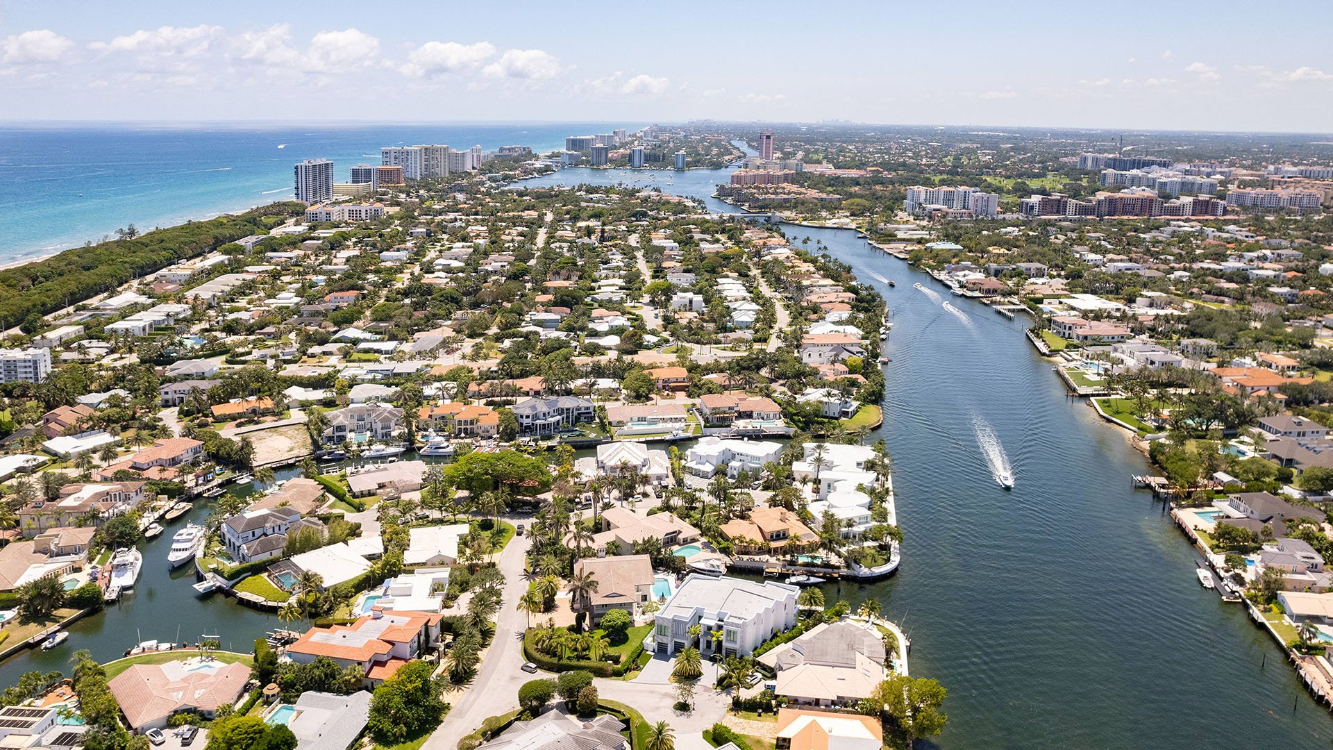749 Bamboo Dr Boca Raton coastal aerial view of waterfront homes and canals, showcasing luxury and ultra luxury resale real estate near Boca Raton condos in Sun and Surf, Boca Raton, Florida.