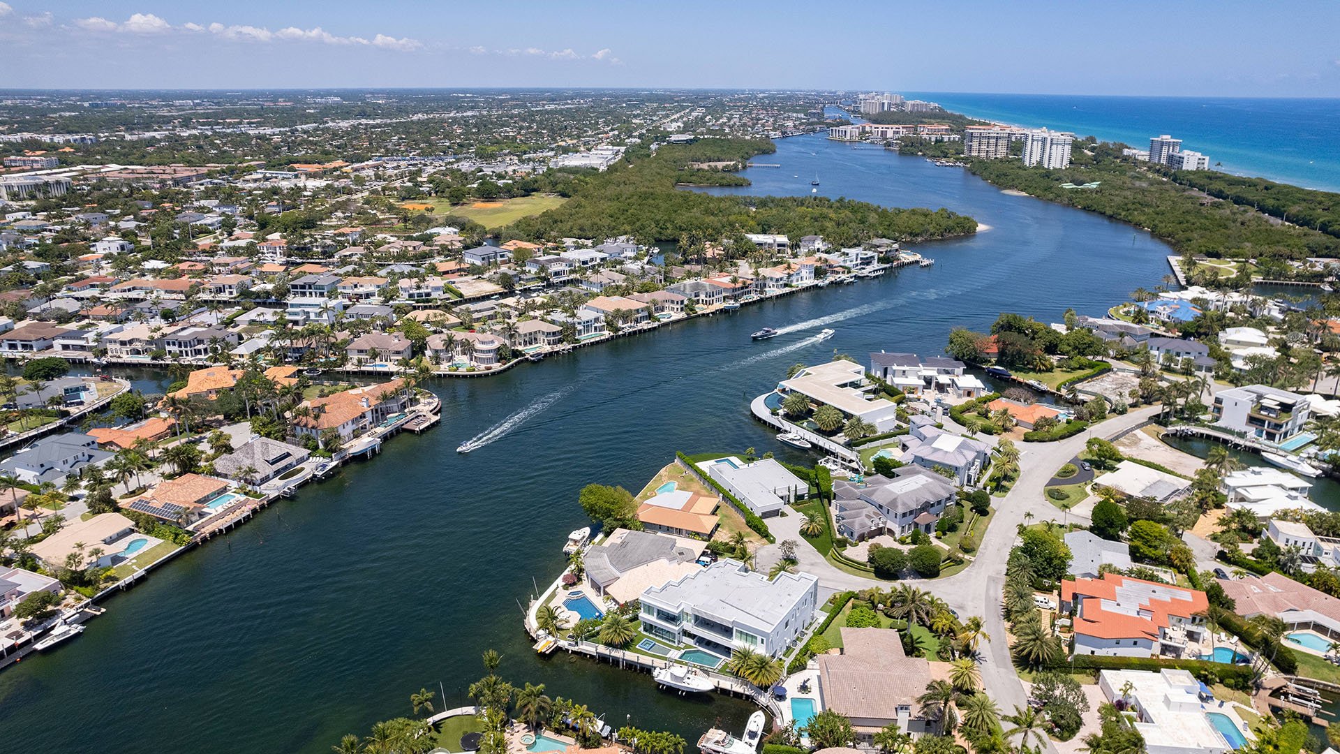 749 Bamboo Dr Boca Raton aerial waterway view of coastal homes and docks, showcasing luxury and ultra luxury resale waterfront living near Boca Raton condos in Sun and Surf, Florida.