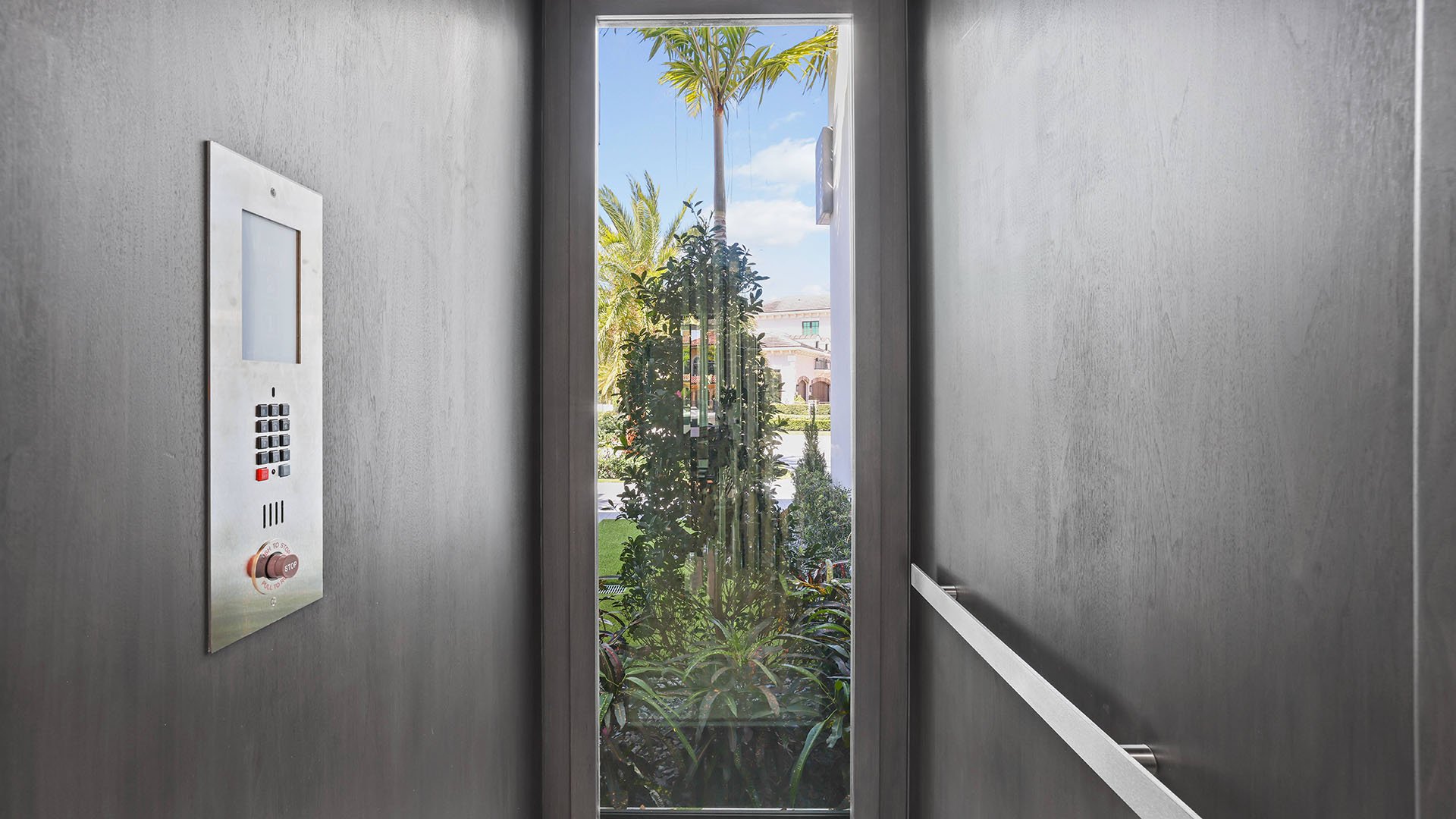 749 Bamboo Dr Boca Raton private elevator with garden view, showcasing luxury and ultra luxury resale home design in Sun and Surf, Boca Raton, Florida, with estate living beyond condos.