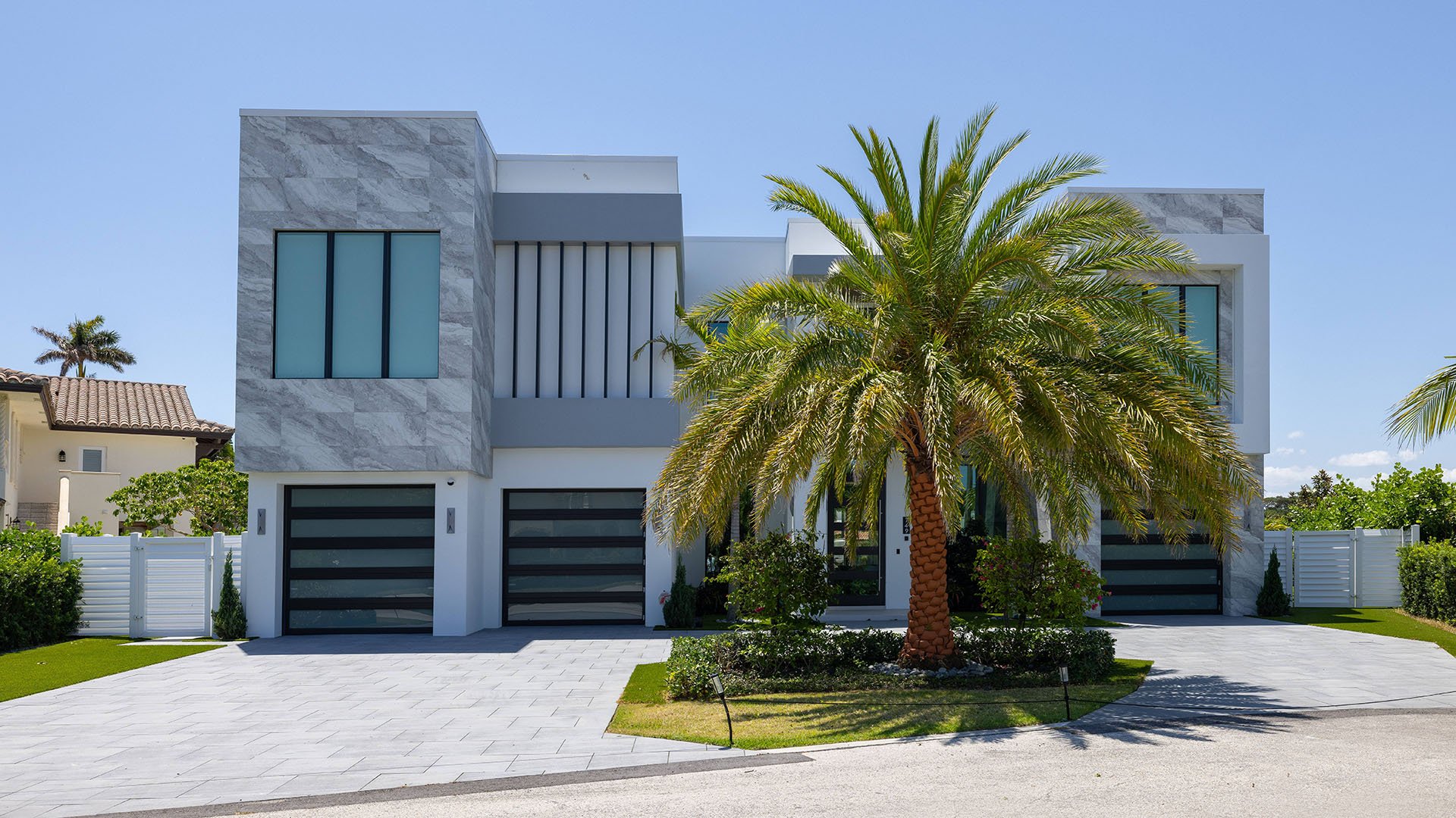 749 Bamboo Dr Boca Raton modern estate exterior with palm trees and architecture, showcasing luxury and ultra luxury resale Sun and Surf waterfront living beyond condos, Boca Raton, Florida.