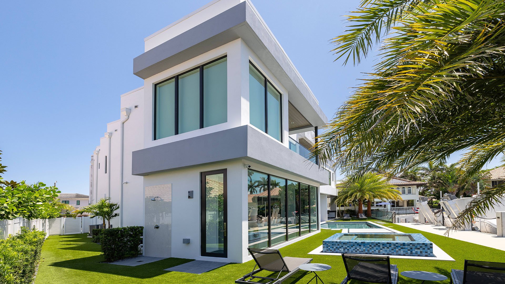 749 Bamboo Dr Boca Raton modern house exterior with poolside garden, showcasing luxury and ultra luxury resale Sun and Surf waterfront estate beyond condos, Boca Raton, Florida.