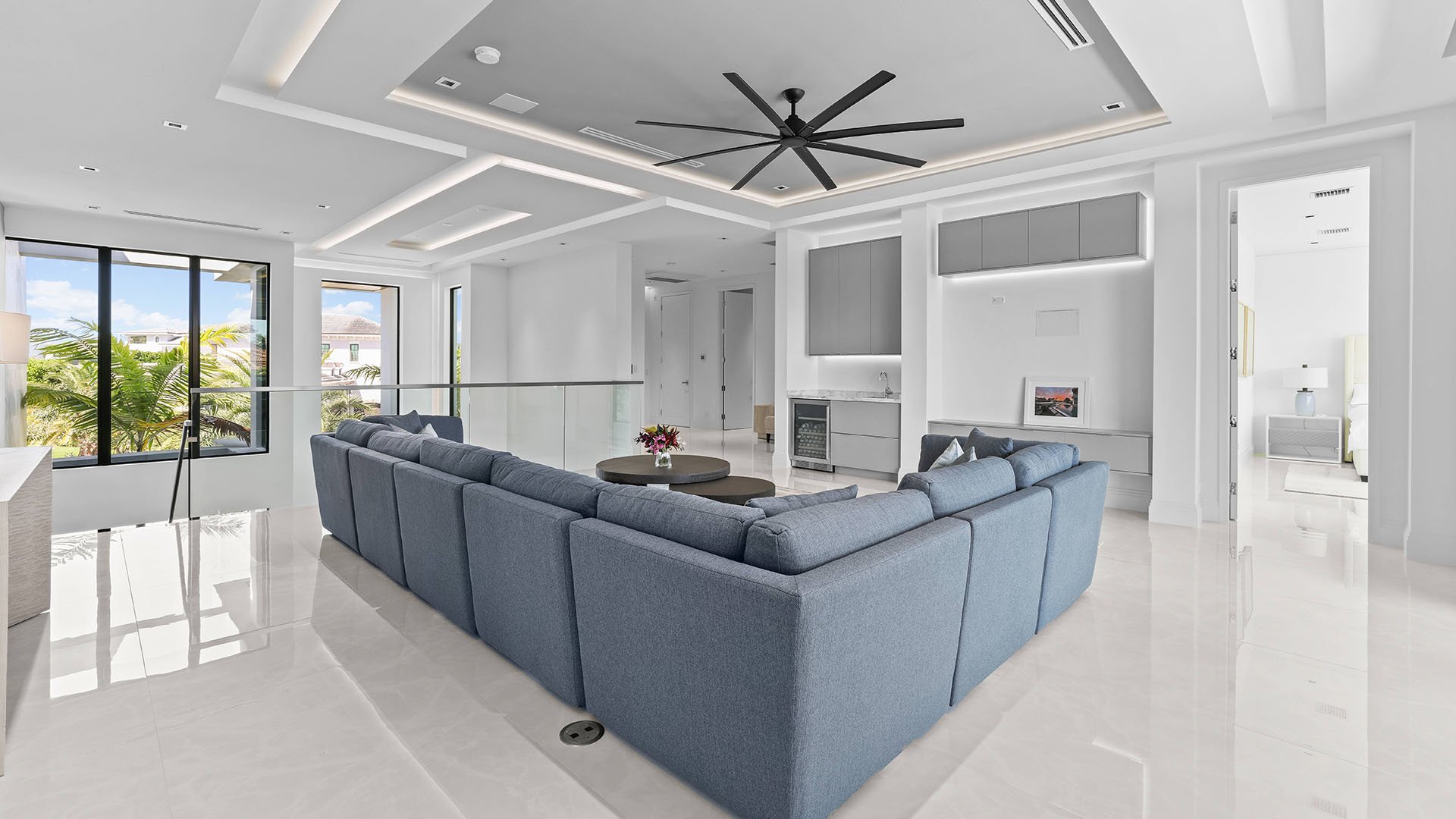 749 Bamboo Dr Boca Raton living room with built-in wine cooler and bar, showcasing luxury and ultra luxury resale Sun and Surf entertaining beyond condos, Boca Raton, Florida.