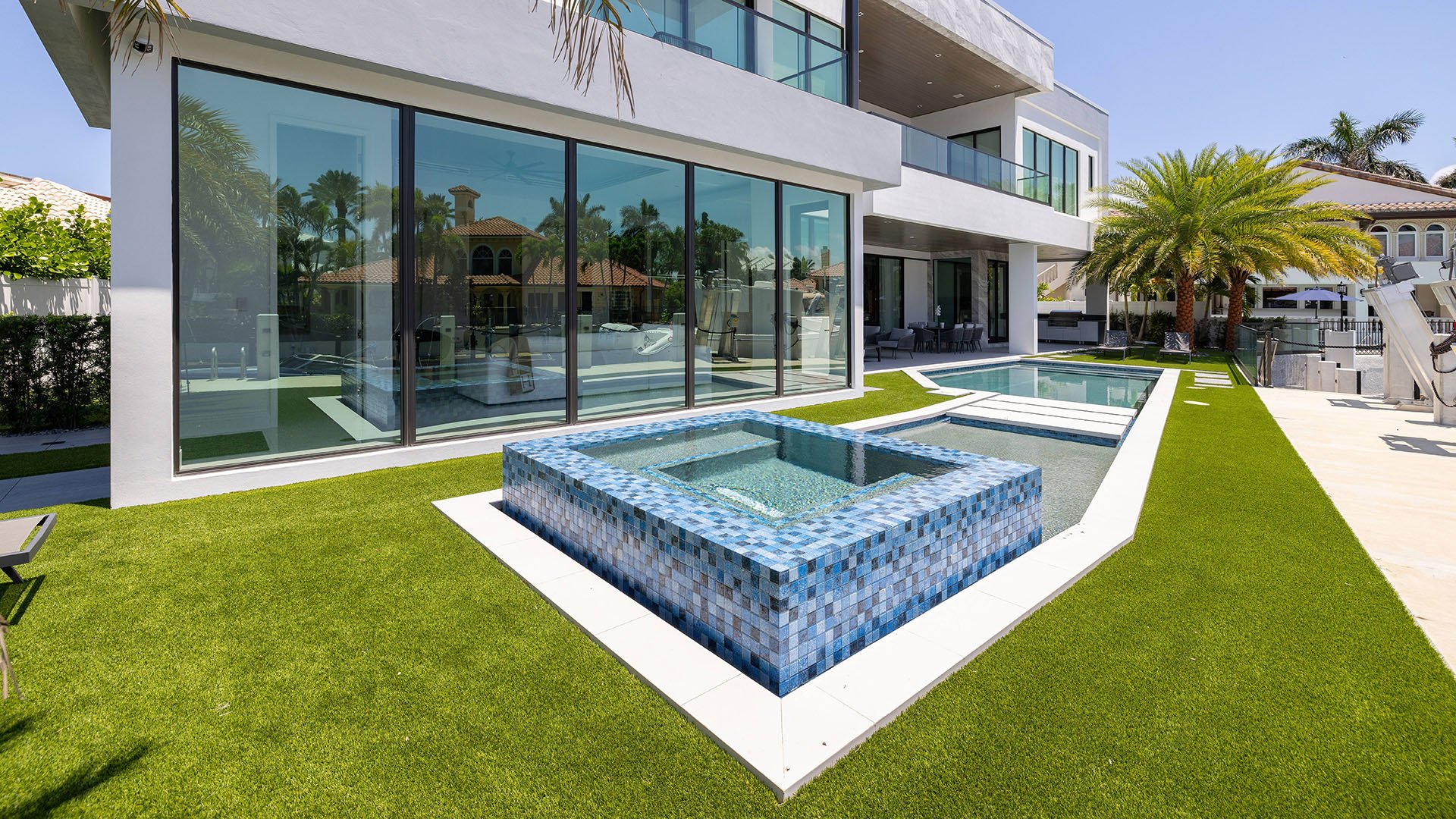749 Bamboo Dr Boca Raton modern poolside with spa and manicured lawn, showcasing luxury and ultra luxury resale Sun and Surf waterfront living beyond condos, Boca Raton, Florida.