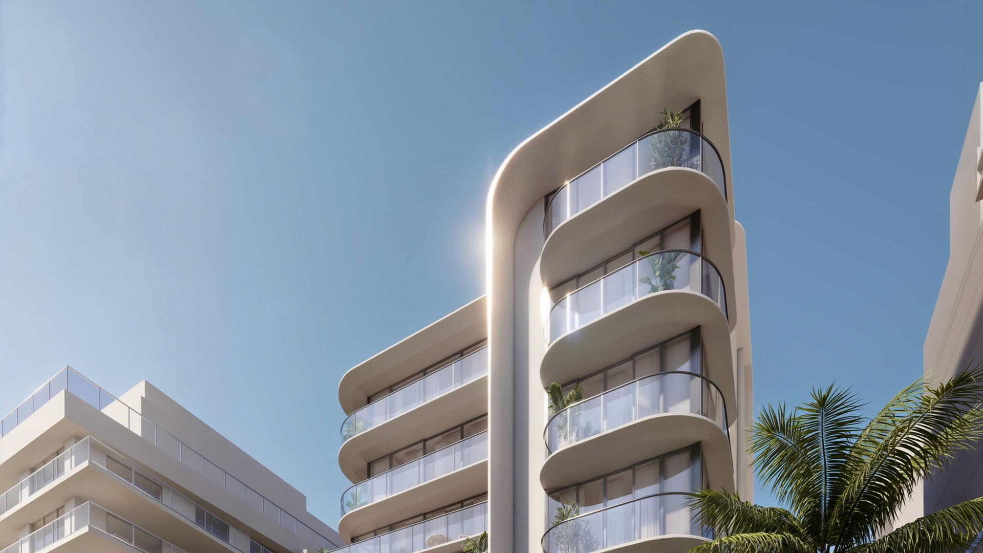Corner exterior of Alma Bay Harbor in Bay Harbor Islands, Miami, with curved architecture and glass balconies, highlighting luxury and ultra luxury preconstruction condos with boutique waterfront appeal.