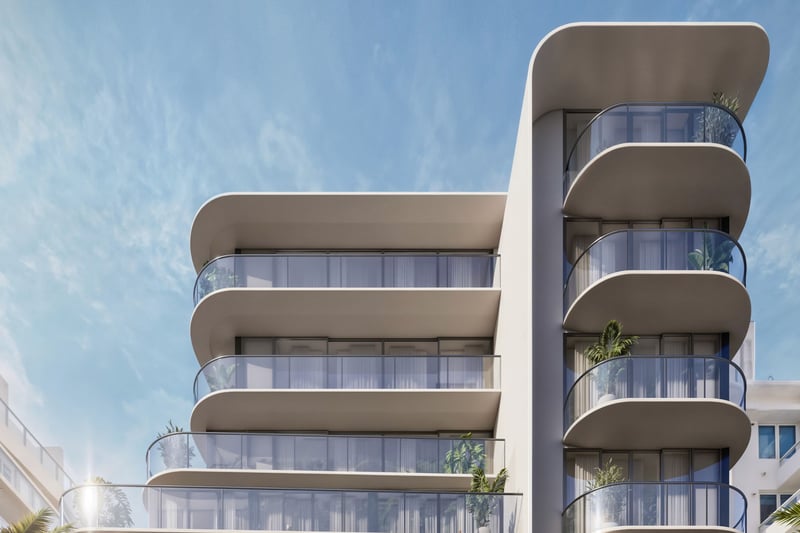 Alma Bay Harbor exterior in Bay Harbor Islands, Miami, with a curved facade and wraparound glass balconies, highlighting luxury and ultra luxury preconstruction condos near the waterfront.