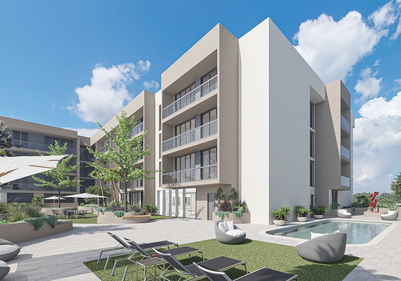 Landscaped courtyard pool deck with loungers, garden seating and low-rise building views at Arbor in Coconut Grove, highlighting luxury and ultra luxury condos with resort-style outdoor amenities.