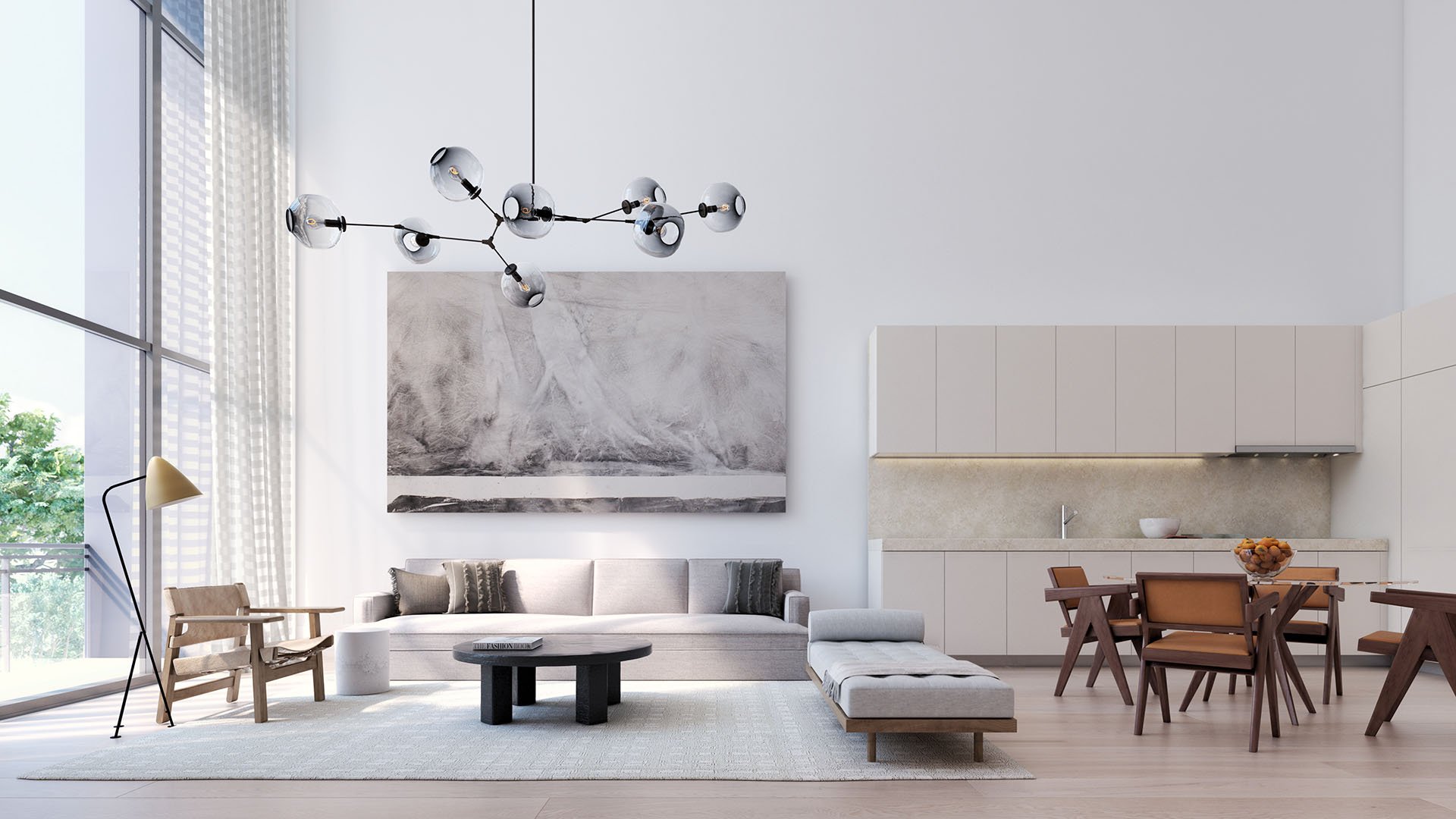 Double-height living and dining room with an open kitchen, oversized art wall and modern chandelier at Arbor in Coconut Grove, showcasing luxury and ultra luxury condos with airy contemporary interiors.