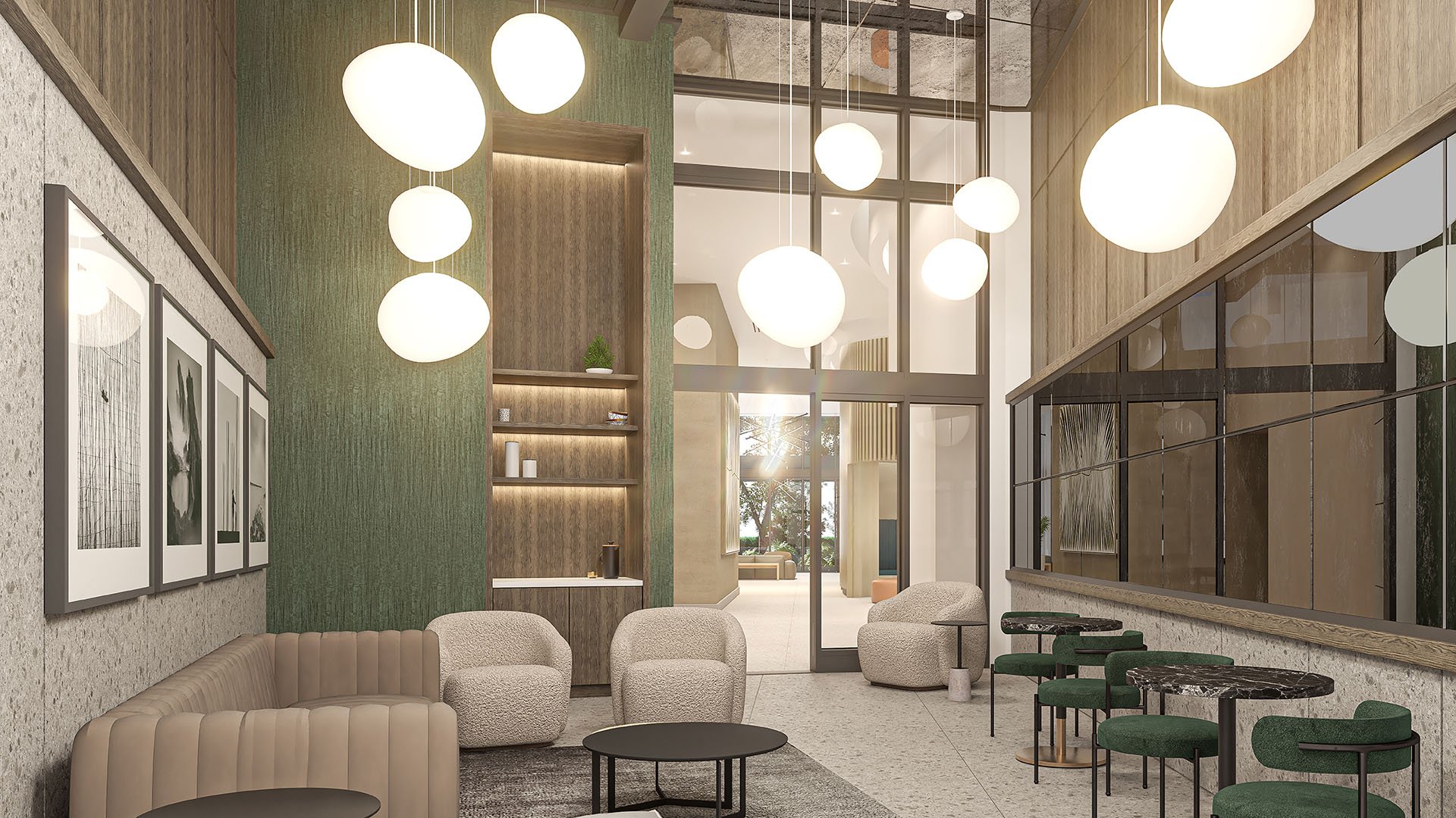 Double-height lobby lounge with cafe tables, globe pendant lighting and soft seating at Arbor in Coconut Grove, expressing luxury and ultra luxury condos with hospitality-inspired social spaces.