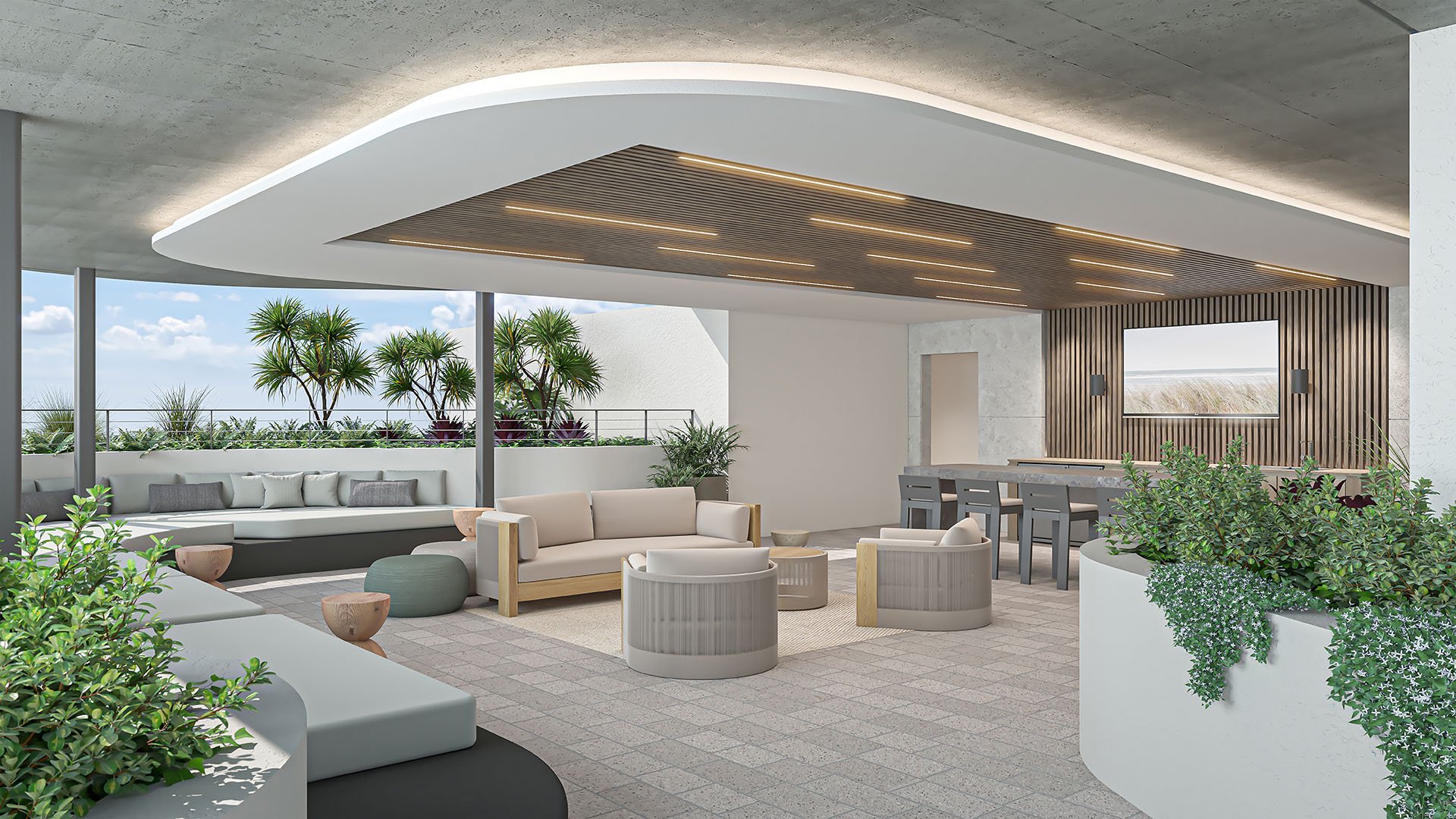 Rooftop lounge with an outdoor kitchen, bar seating, layered sofas and tropical planting at Arbor in Coconut Grove, highlighting luxury and ultra luxury condos with elevated amenity spaces.
