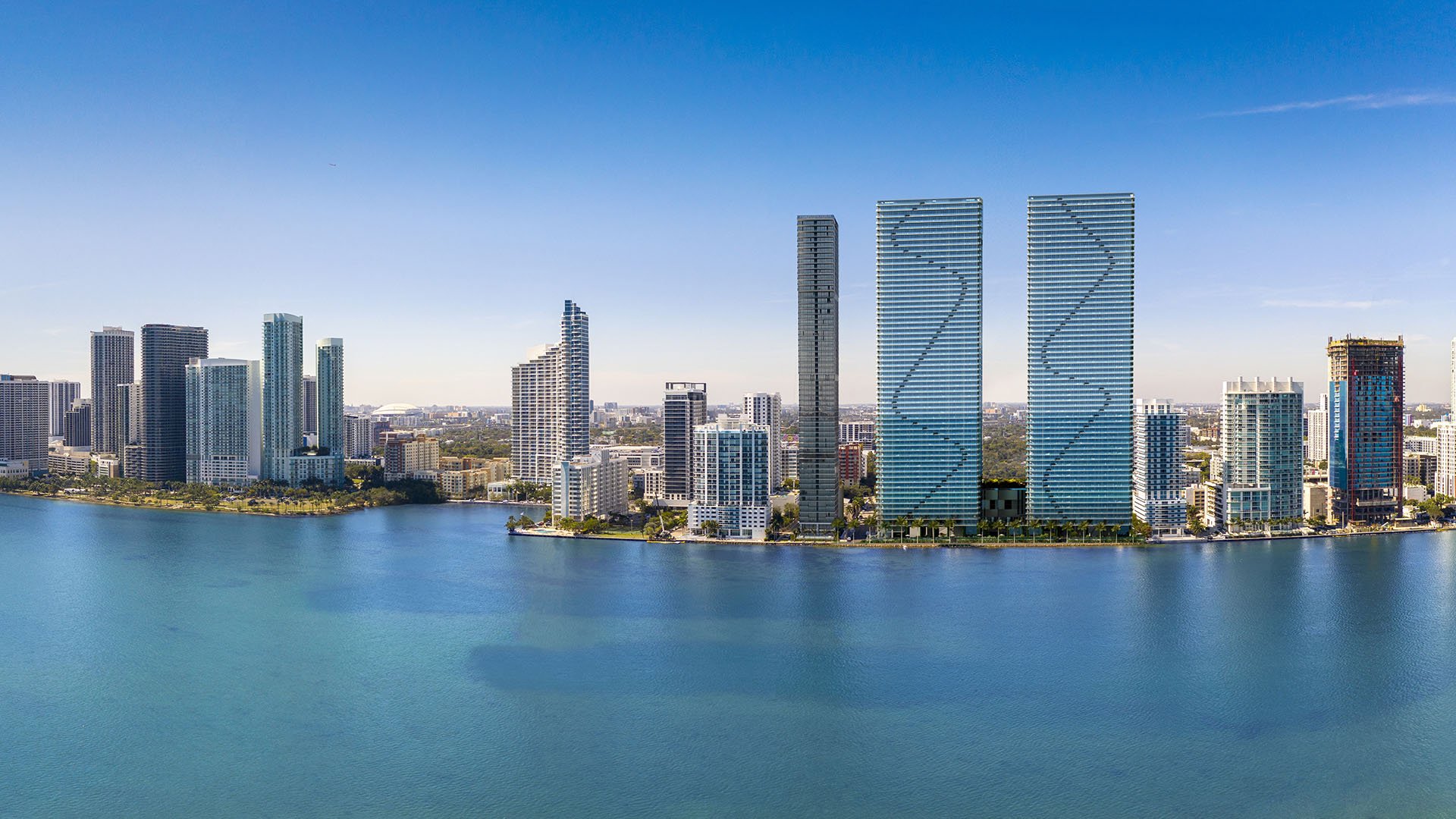 Aria Reserve Edgewater Miami daytime panorama of Biscayne Bay and Downtown skyline with planned twin towers, showcasing luxury and ultra luxury preconstruction condos waterfront living in Edgewater.