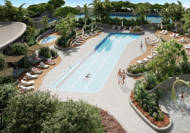 Aerial view of Aria Reserve Edgewater Miami pool deck with lap pool, cabanas, sun loungers and splash pad, showcasing luxury and ultra luxury preconstruction condos with resort-style amenities and tropical gardens.