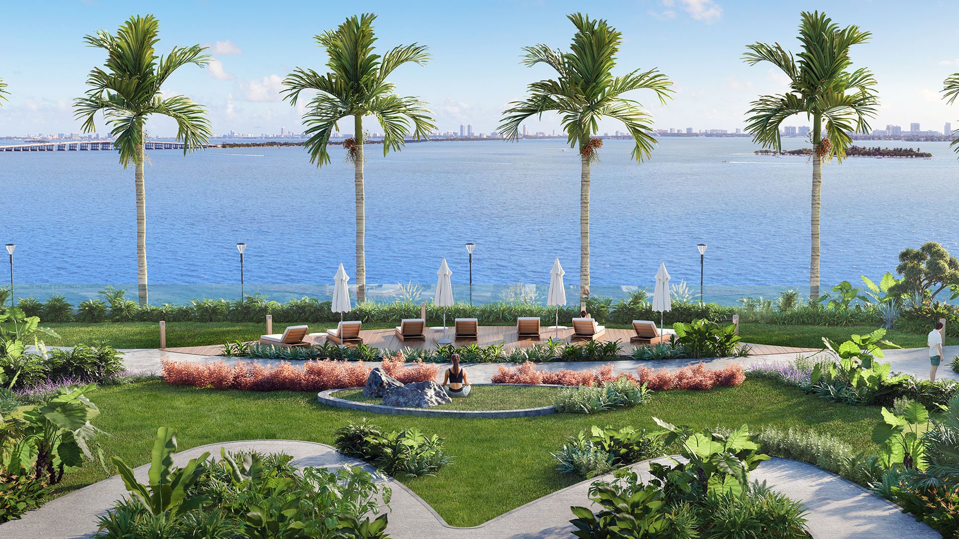 Aria Reserve Edgewater Miami waterfront tropical garden with sun loungers on Biscayne Bay, highlighting luxury and ultra luxury preconstruction condos with landscaped paths, palm trees, and serene bayfront relaxation.