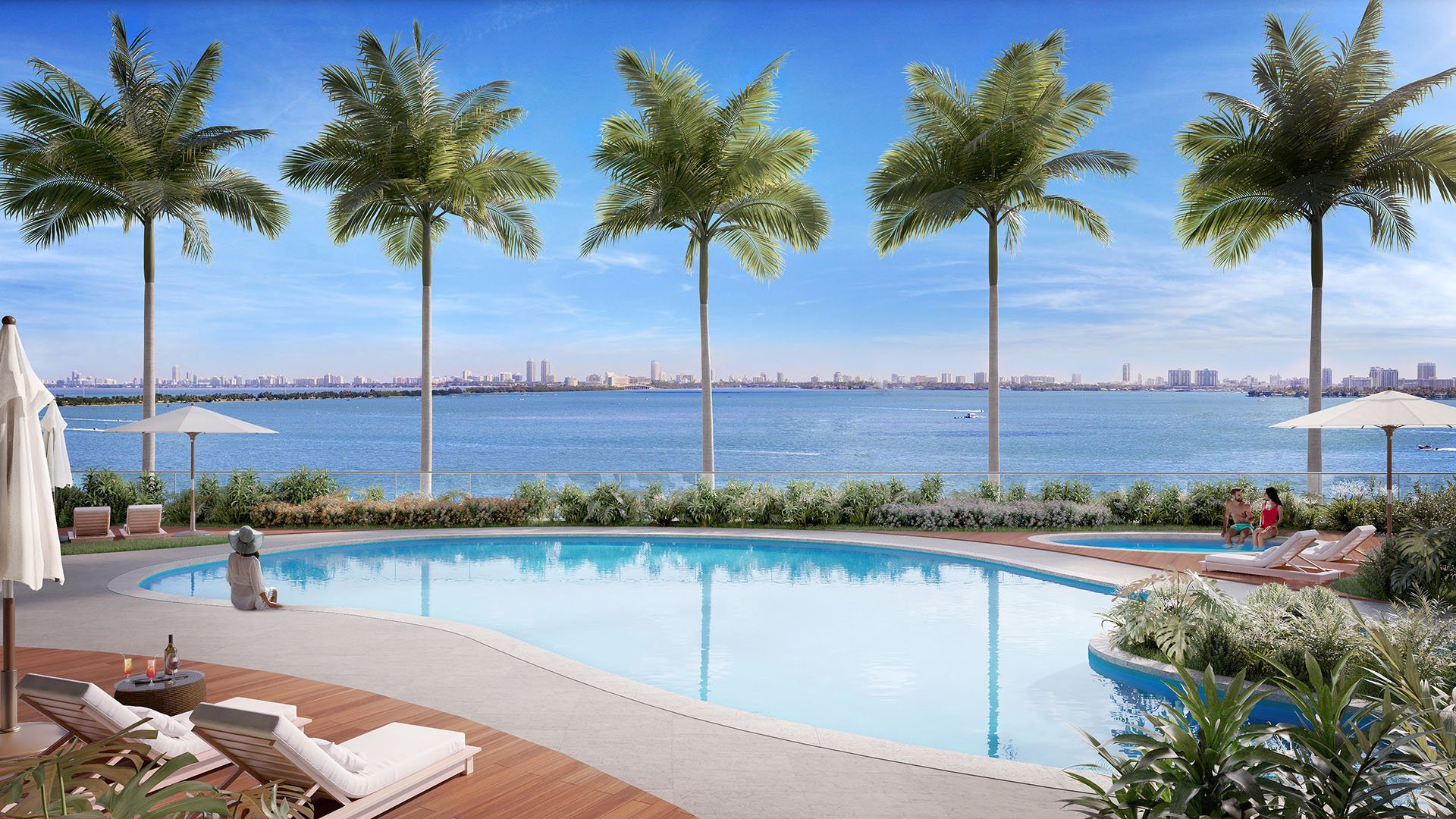 Aria Reserve Edgewater, Miami bayfront resort pool with palm-lined deck, Biscayne Bay and skyline views, showcasing luxury and ultra luxury preconstruction condos with waterfront leisure amenities.