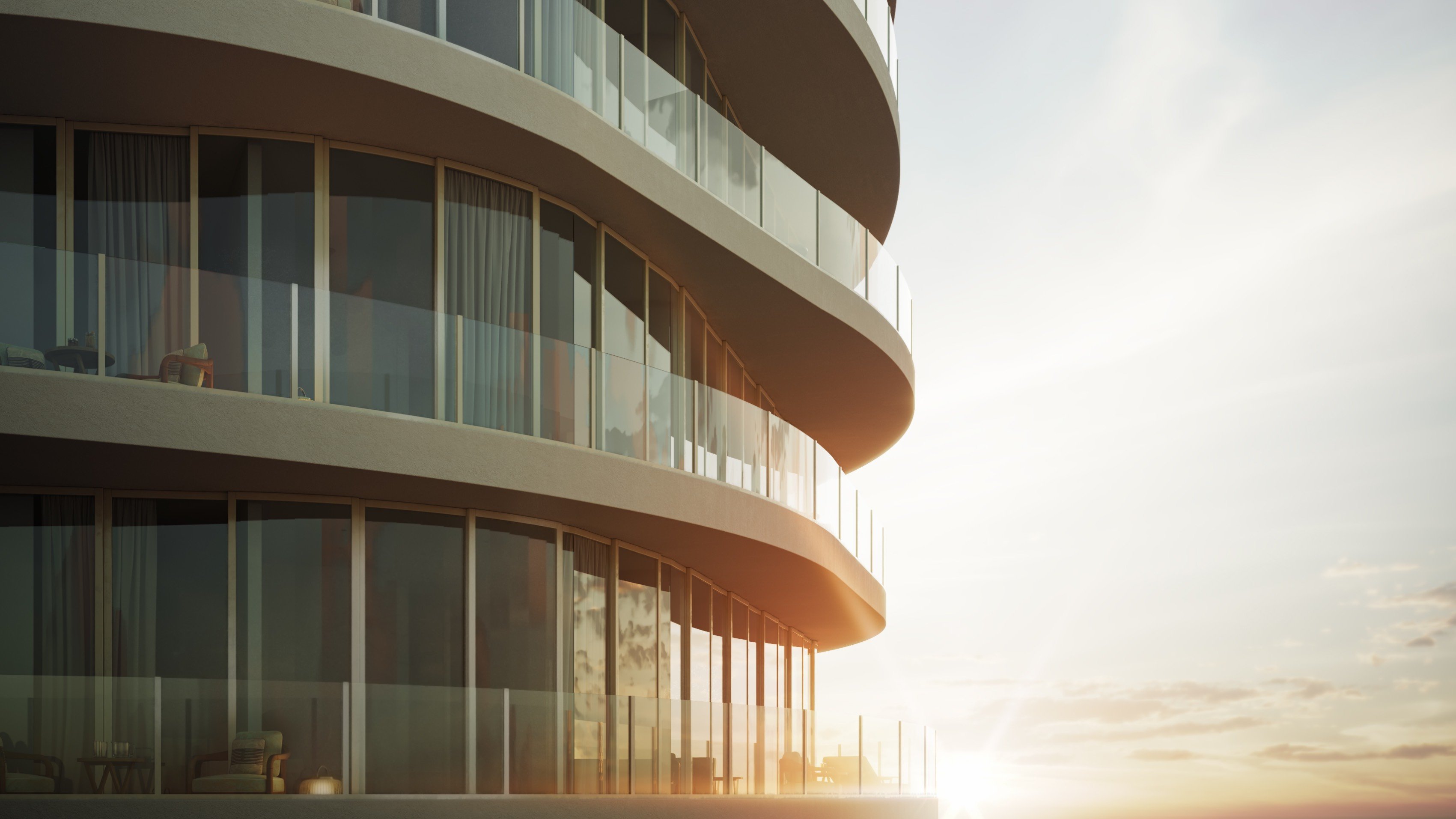 Armani Casa Pompano Beach. Curved, modern glass balconies of a building at sunset, with sunlight reflecting off the windows. Featuring architecture.