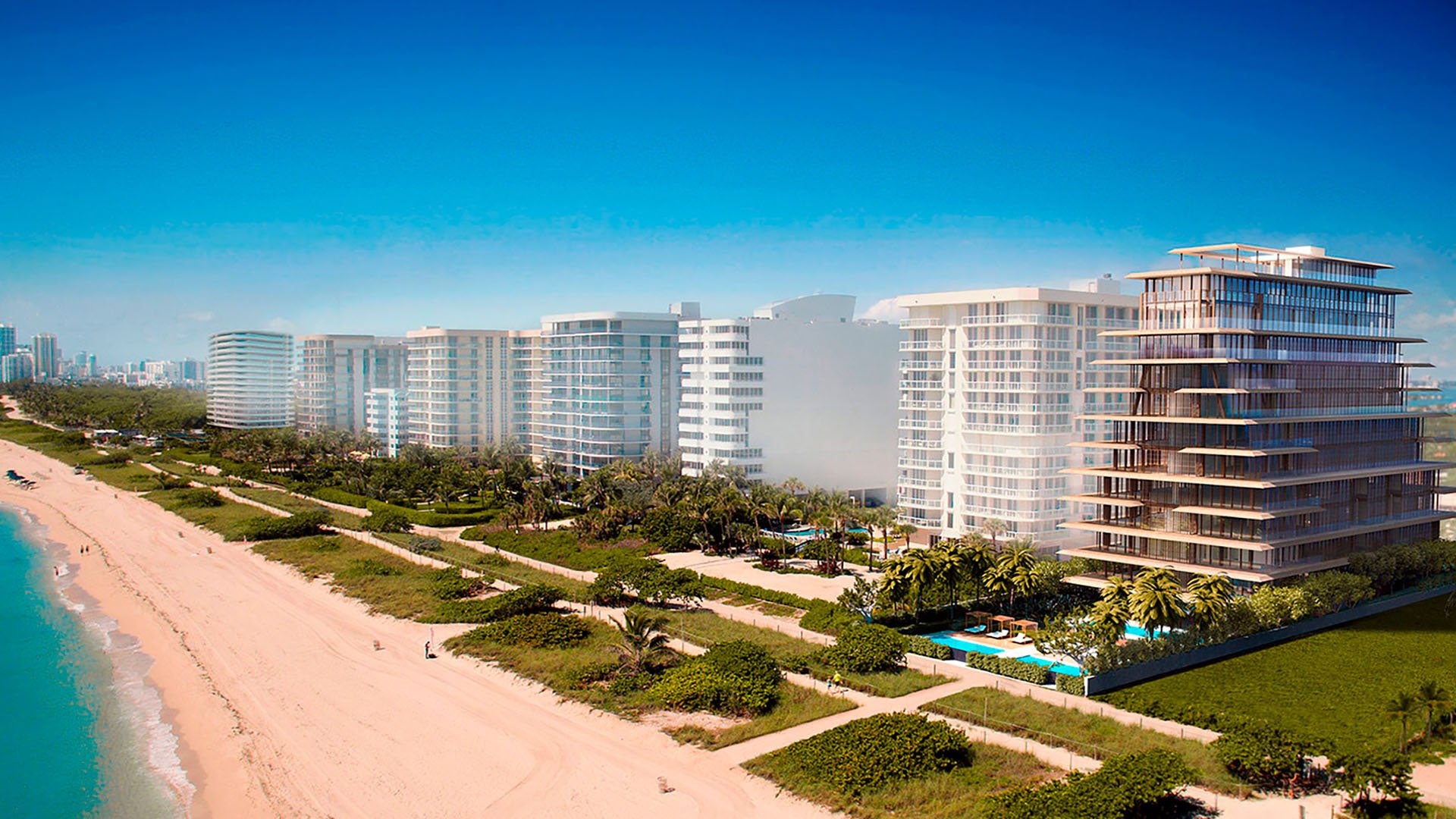 Beachfront skyline view of Arte Surfside, Surfside, Florida, featuring luxury and ultra luxury condos along the sand with neighboring waterfront towers and the Atlantic shoreline.