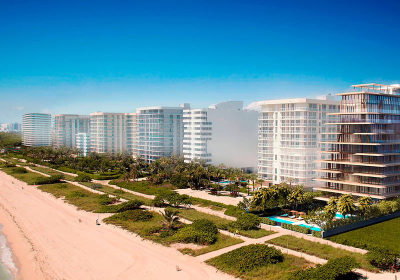 Beachfront skyline view of Arte Surfside, Surfside, Florida, featuring luxury and ultra luxury condos along the sand with neighboring waterfront towers and the Atlantic shoreline.