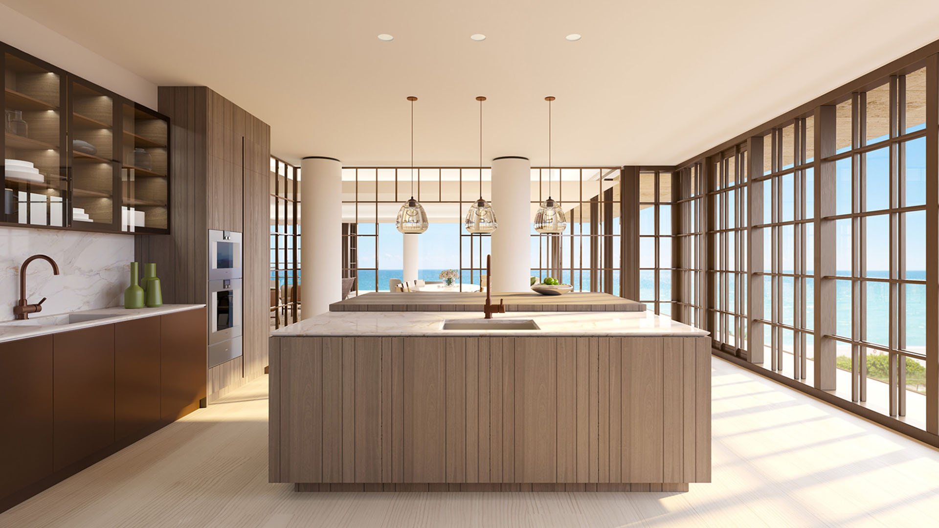 Chef kitchen at Arte Surfside, Surfside, Florida, showing luxury and ultra luxury condos with a large island, custom cabinetry, pendant lights, and ocean views.