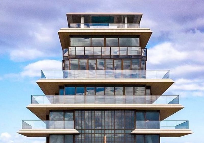 Symmetrical exterior at Arte Surfside, Surfside, Florida, highlighting luxury and ultra luxury condos with layered terraces and a sculptural stepped tower profile.