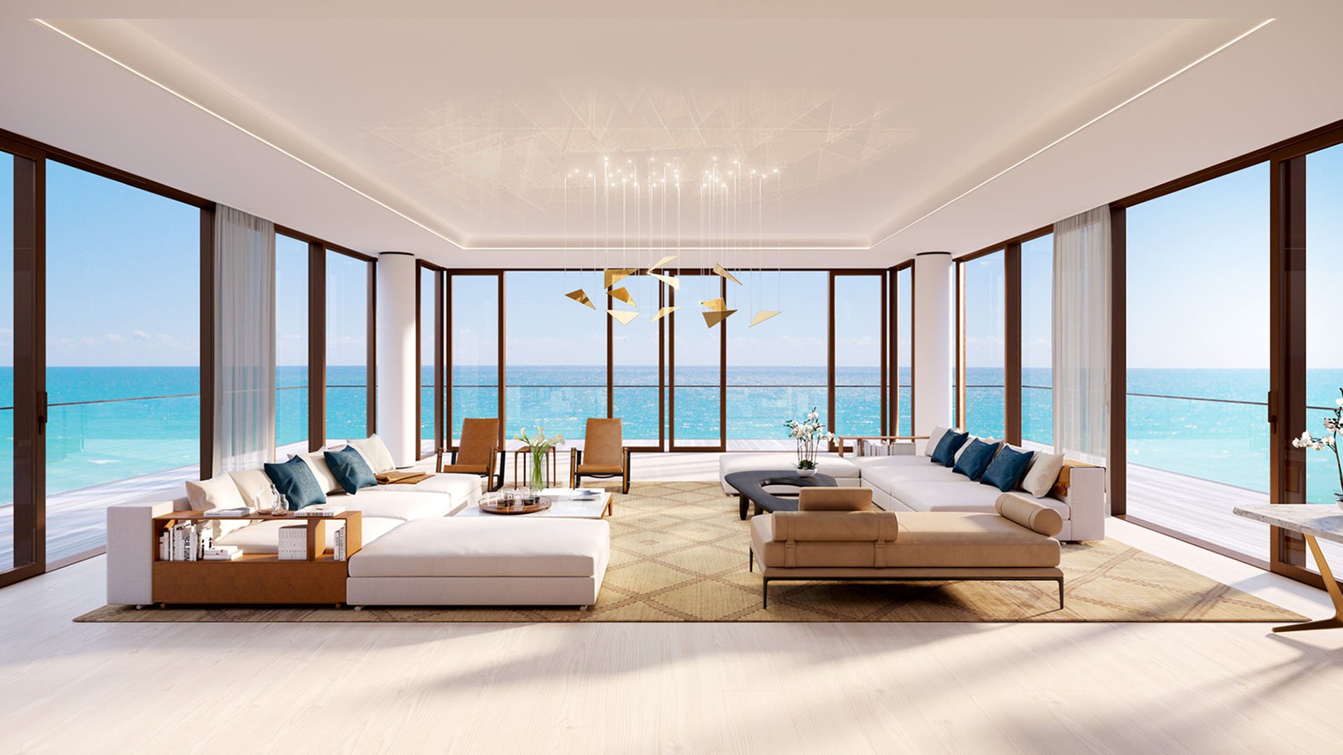 Living room at Arte Surfside, Surfside, Florida, presenting luxury and ultra luxury condos with wraparound glass, expansive sofas, and panoramic ocean views.