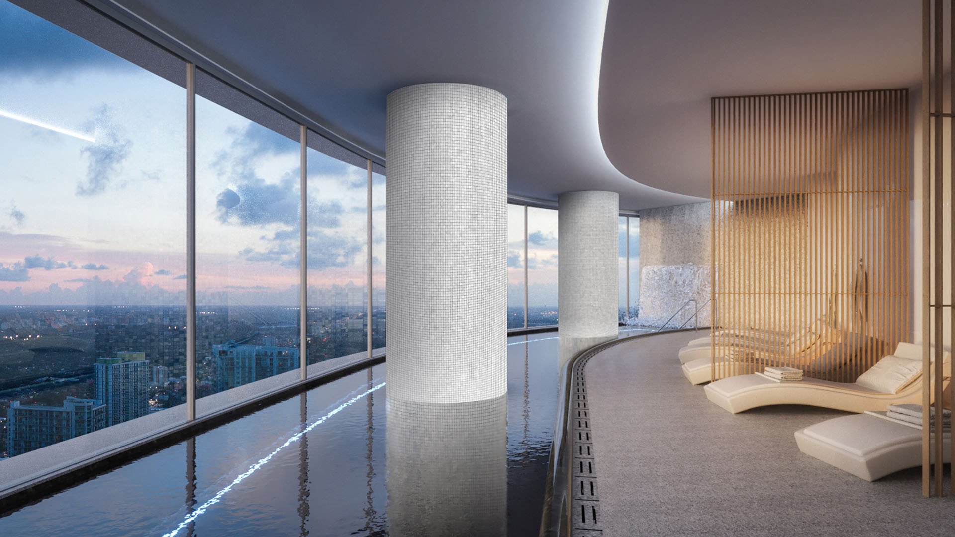 Aston Martin Residences in Downtown Miami luxury and ultra luxury condos indoor spa lounge with a lap pool, chaise seating, warm wood accents, and skyline views at dusk.