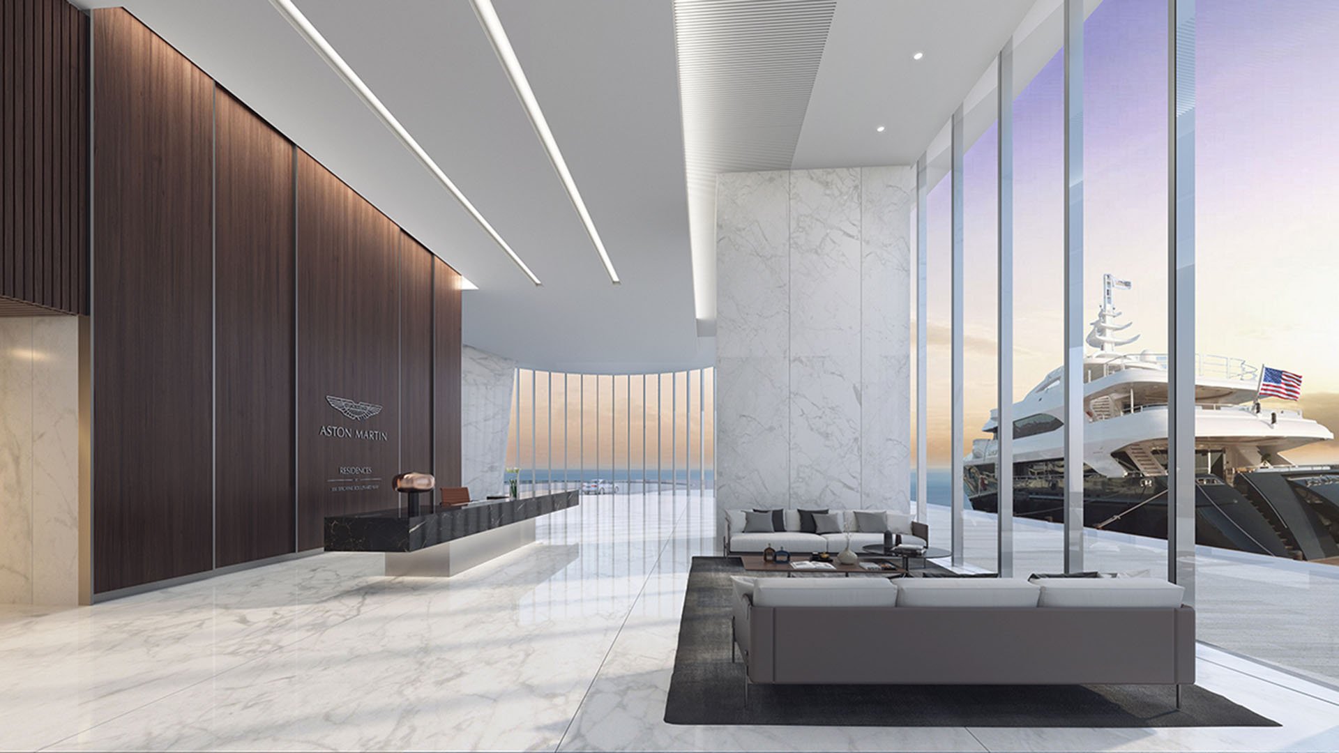 Aston Martin Residences in Downtown Miami luxury and ultra luxury condos marble lobby reception with a wood-paneled feature wall, lounge seating, and a sleek desk.