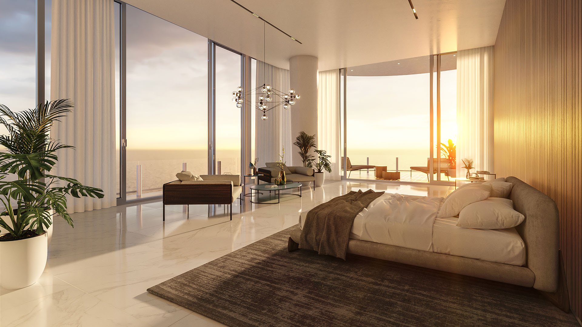 Aston Martin Residences in Downtown Miami luxury and ultra luxury condos primary bedroom suite with lounge seating, a private terrace, and sunrise water views.