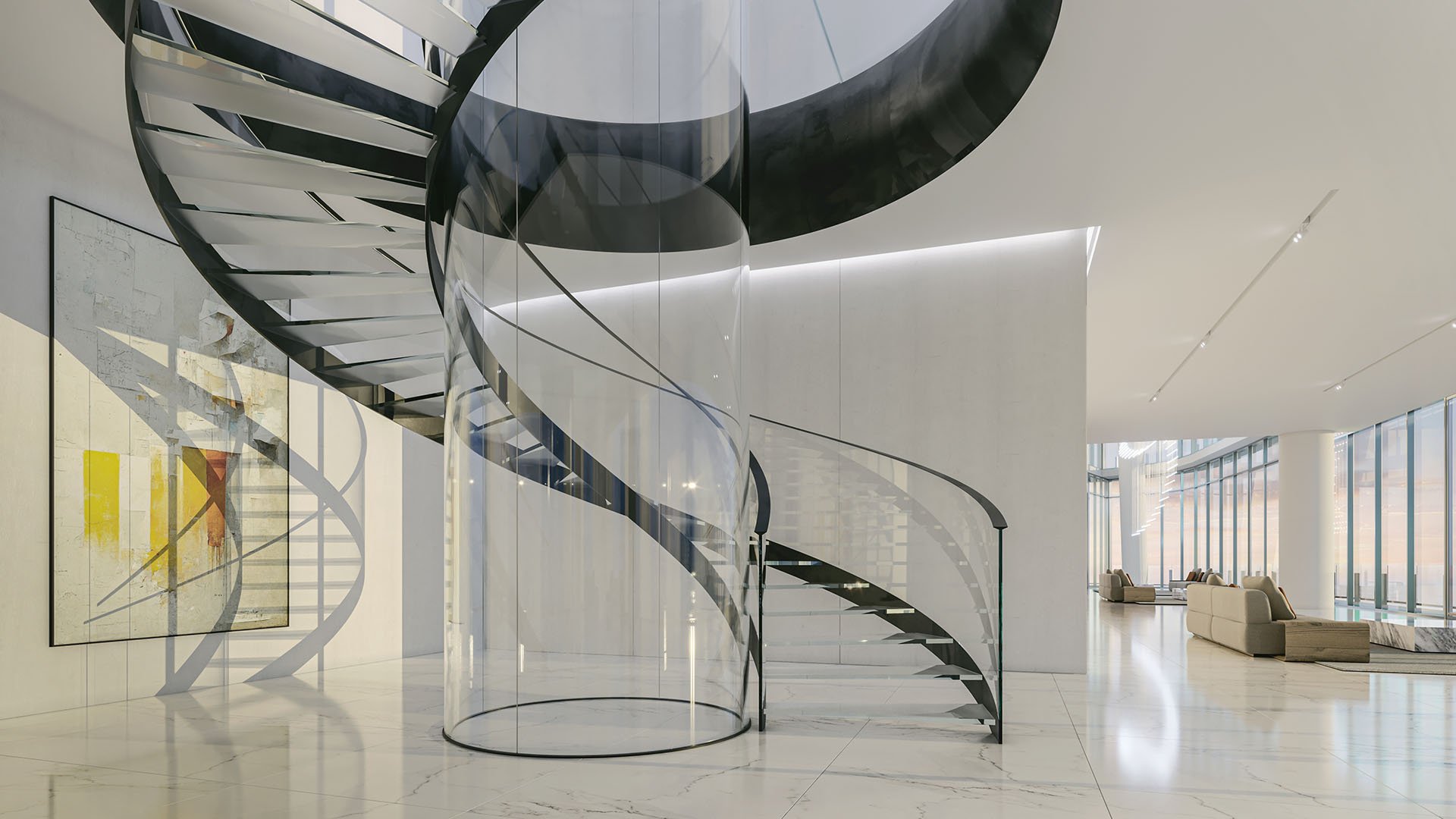 Aston Martin Residences in Downtown Miami luxury and ultra luxury condos sculptural spiral staircase lobby gallery with glass enclosure, modern art, and polished stone floors.