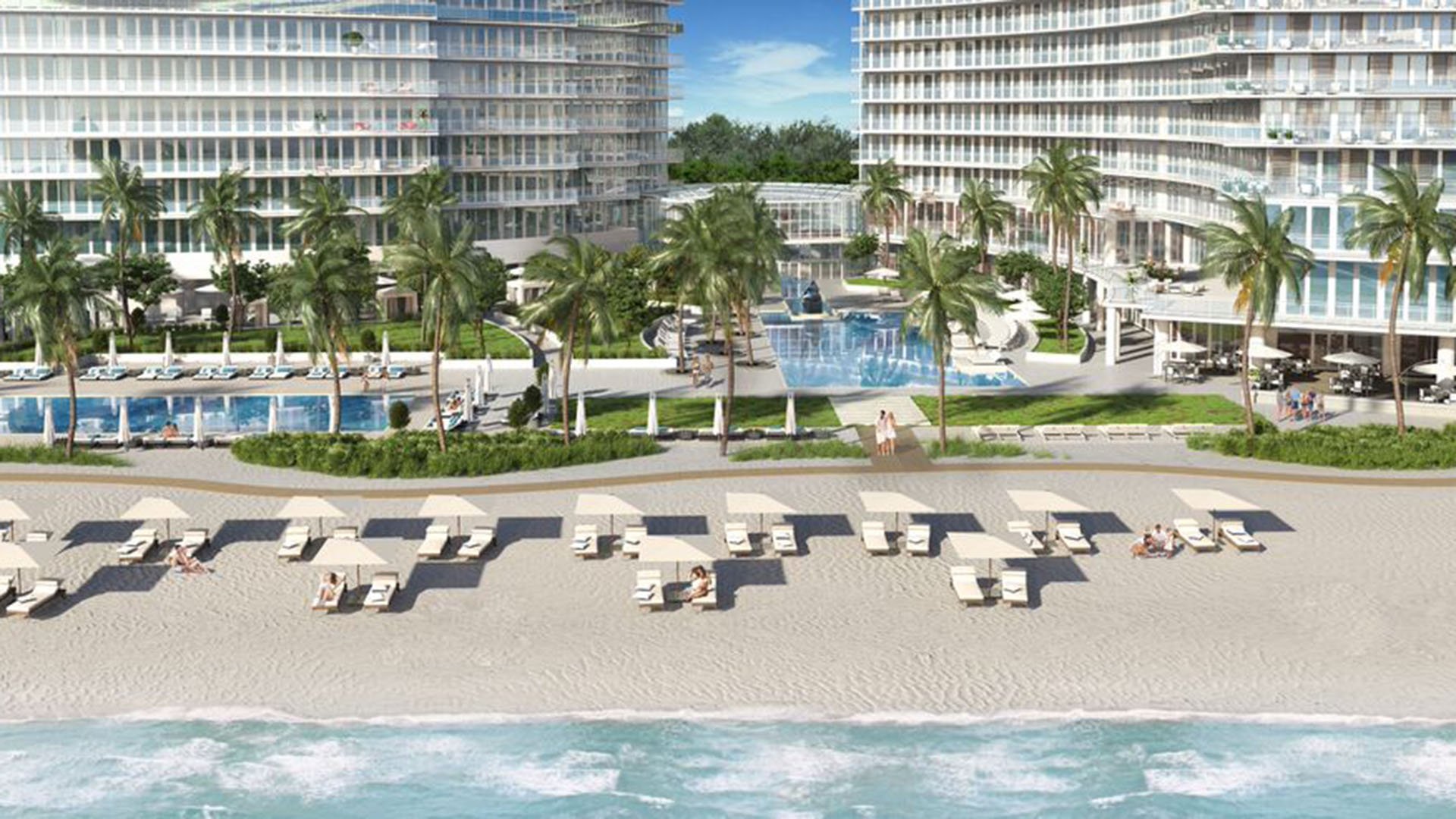 Auberge Beach Residences, Fort Lauderdale luxury and ultra luxury condos beachfront pool deck courtyard with palms, lounge chairs, twin towers, and direct views across the sand to the ocean.