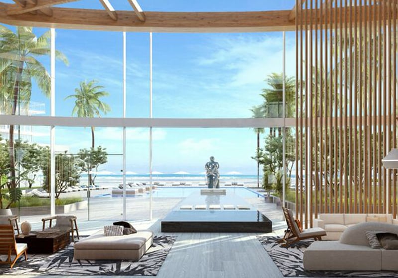 Auberge Beach Residences, Fort Lauderdale luxury and ultra luxury condos lobby lounge with a wood screen, reflecting pool, sculpture, and a direct visual connection to the ocean.