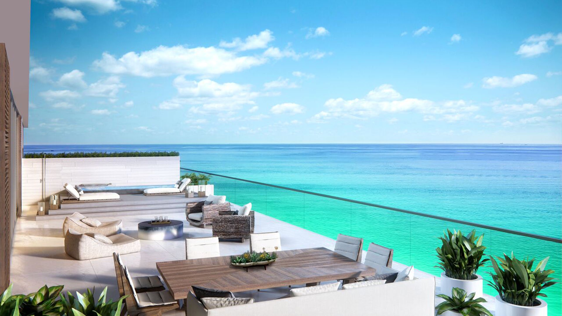 Auberge Beach Residences, Fort Lauderdale luxury and ultra luxury condos oceanfront sun deck with dining space, lounge seating, and uninterrupted blue water views.