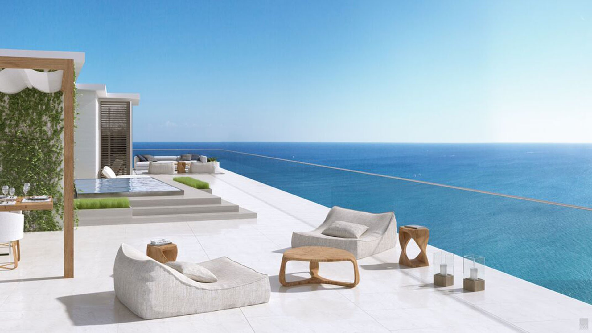 Auberge Beach Residences, Fort Lauderdale luxury and ultra luxury condos oceanfront terrace with a plunge pool, sculptural lounge chairs, and a minimalist deck overlooking the water.