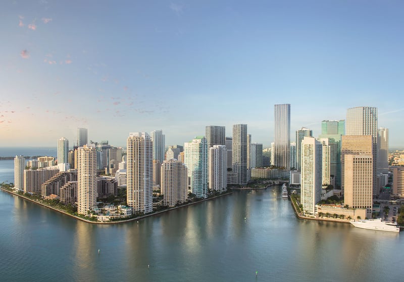 Baccarat Residences in Brickell, Miami, luxury and ultra luxury condos featuring a daylight aerial of the waterfront skyline, calm bay water, and high-rise towers.