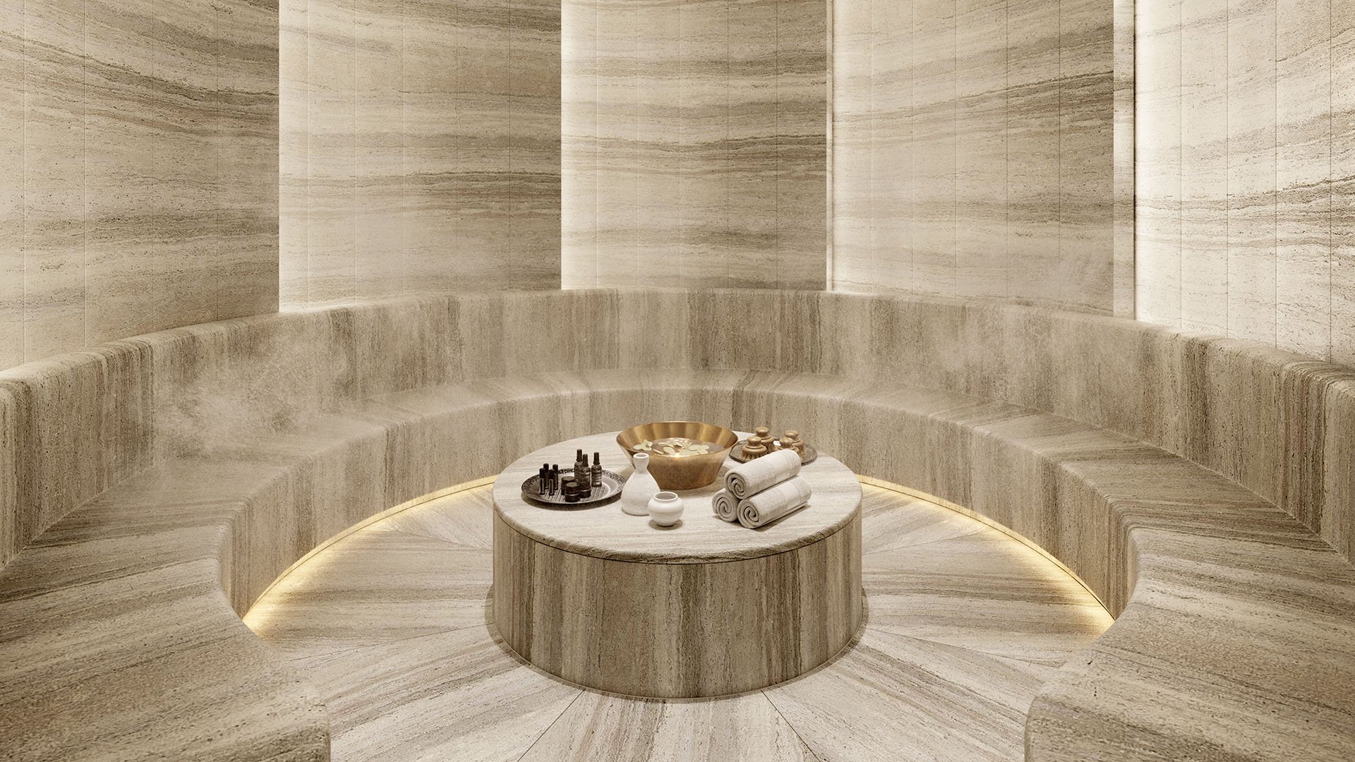Baccarat Residences in Brickell, Miami, luxury and ultra luxury condos featuring a hammam steam room, circular stone seating, soft underlighting, and a central spa ritual table.